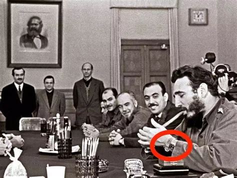 PHOTO: Fidel Castro, wearing 2 Rolexes, lighting a cigar while 